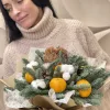 Букет «Мандариновый декабрь» с елью, мандаринами и хлопком